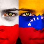 Portrait of a boy with the flag of Chile painted on his face.